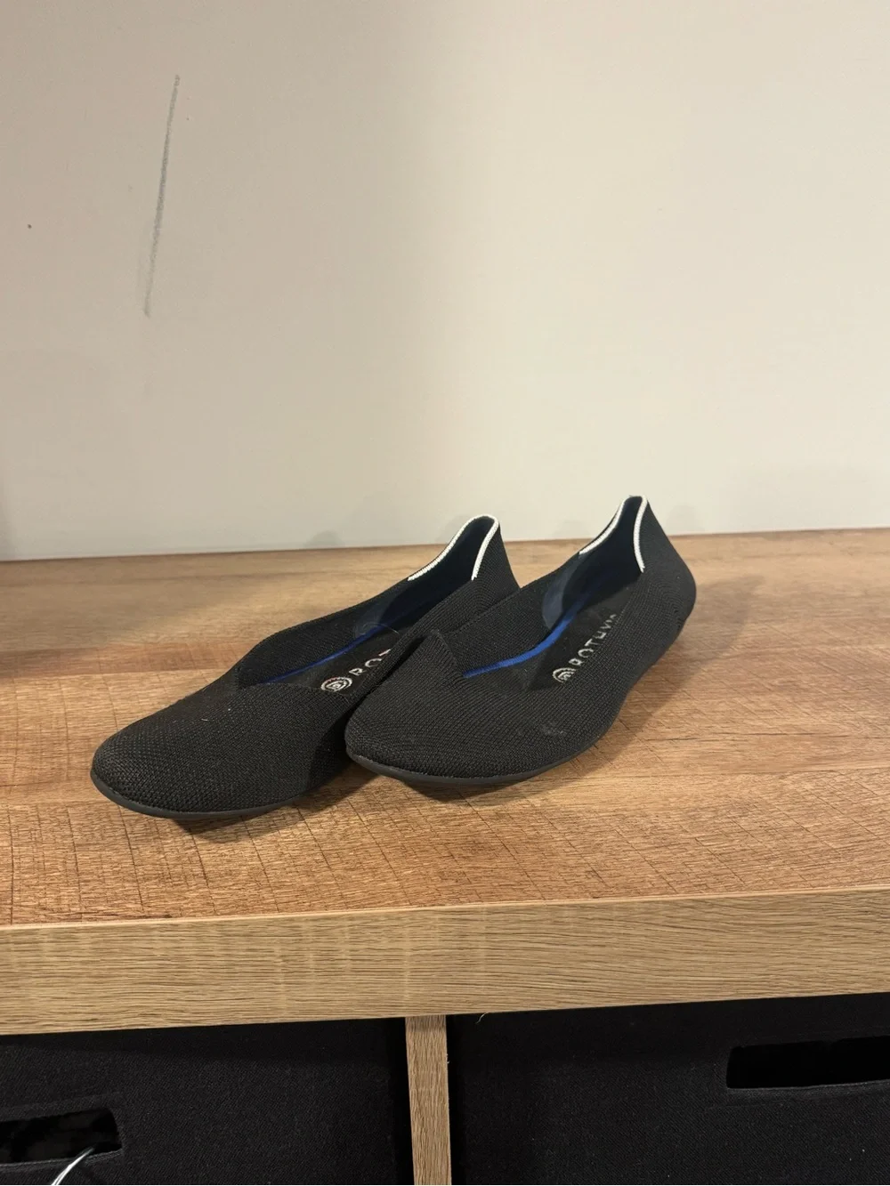 Rothy's Black Slip-On Flats with White Trim